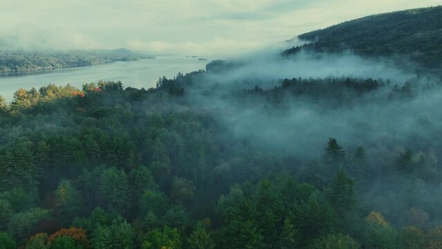 Autumn foliage aerial view in Lake George with morning fog