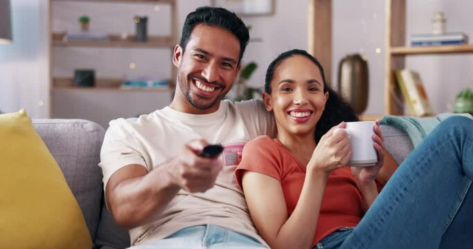 Remote control, relax and couple watching tv on a sofa, happy and laughing in their home together. Chilling, television and man with woman in living room for movie, streaming or subscription service