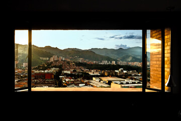 Medellin seen from the window of an apartment during sunset