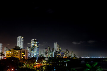 Obraz na płótnie Canvas Panoramic night view of buildings with port in the background in Cartagena de Indias, Colombia