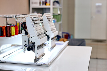 empty room, clothing manufacturing factory. sewing department with modern equipment, tailors' sewing studio, sewing school, clothing manufacturing, sewing industry. no people