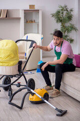 Young male contractor cleaner looking after newborn