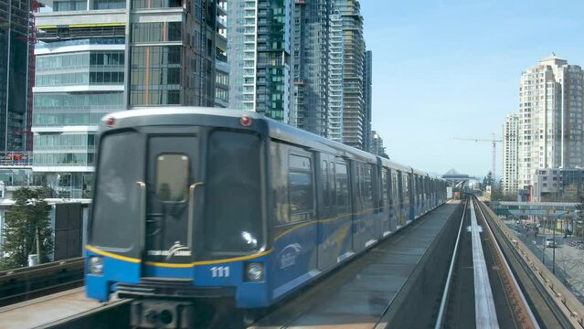 Vancouver, BC, Canada, Skytrain Monorail Starts and Goes Down Track, Vancouver BC Canada. High quality 4k footage
