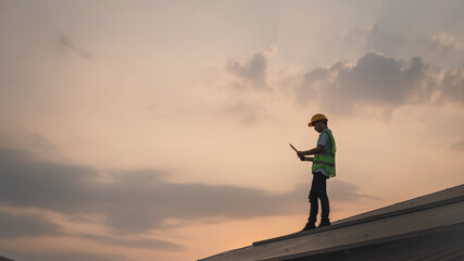 Service engineer checking solar cell on the roof for maintenance if there is a damaged part. Engineer worker install solar panel. Clean energy concept. © NewSaetiew