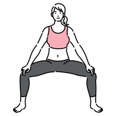 ワイドスクワットをしているトレーニングウェアを着た若い女性

