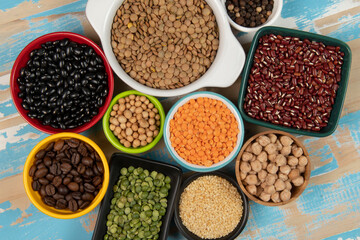 assorted bowls with raw grain and seeds top view