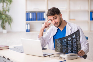 Young male doctor radiologist working in the clinic