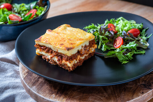 Lasagna with meat, cheese and salad