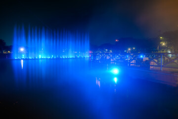 colorful musical fountain on a lake at night at Laman Budaya Shah Alam, Selangor, Malaysia