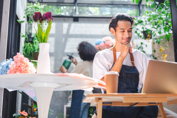 Asian man influencer or SME owner people smile work on home video camera selfie shoot.Smiling female florist talking on mobile phone. Young woman working at  shop with Open sign.