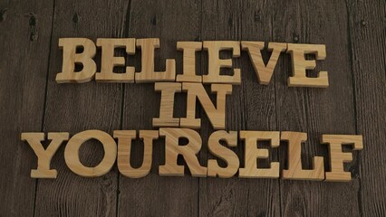 Believe in yourself, text words typography written with wooden letter, life and business motivational inspirational