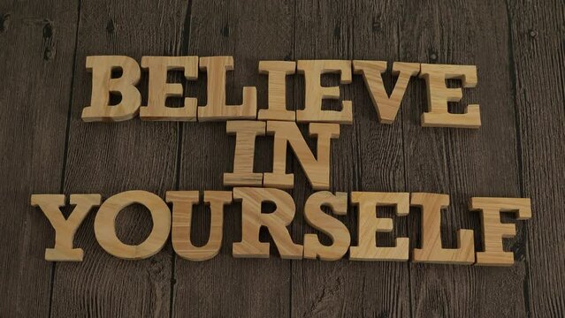 Believe in yourself, text words typography written with wooden letter, life and business motivational inspirational