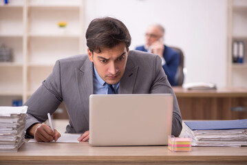 Two male colleagues sitting in the office