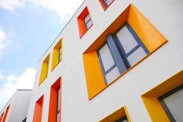  orange color large window against blue sky 