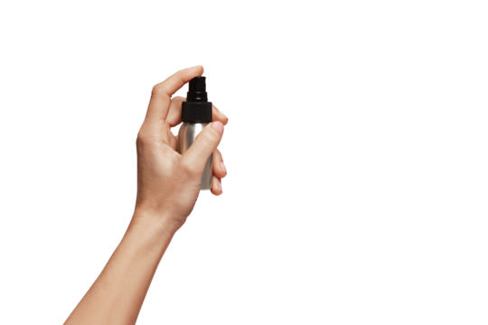 Hand holding spray bottle.