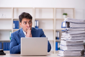 Young male employee working in the office