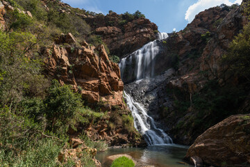 Beautiful Waterfall at the Krugersdorp Botanical gardens. Beautiful nature with stunning water patterns and greenery showing the lush beauty as the water cascades