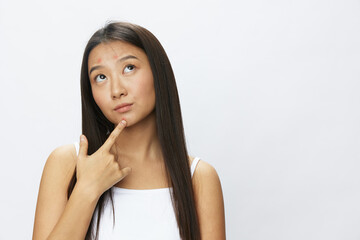 Asian woman facial skin problems, acne and inflammation, red rashes and allergies, chicken pox, sadness from rashes. Facial skin care concept for diseases and nerves