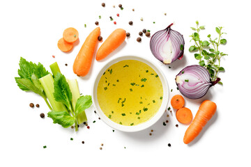 Chicken broth, stock or bouillon with vegetables isolated on white background. top view - 590711126