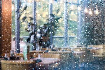 restaurant view raindrops on glass window