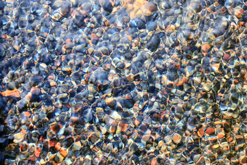 transparent water stones on the bottom multicolor abstract pattern