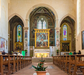 interior of the St.Augustine church: painting that decorates - Coronation of the Madonna- the main altar is a masterpiece from 1483 by Piero del Pollaiolo - Siena province,Tuscany, Italy