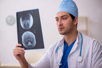 Young male doctor radiologist working in the clinic