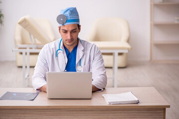 Young male doctor otologist working in the clinic