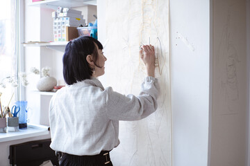 woman looking out window