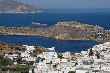 Panoramic view of the whitewashed village and the port of Ios Greece