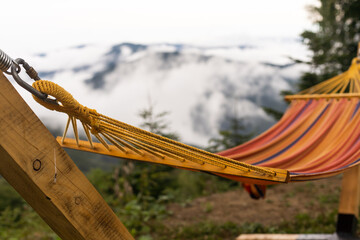 Empty hammok hanging in the mountains in summer