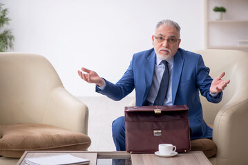 Old businessman waiting for business meeting