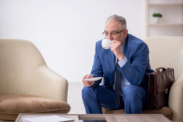 Fototapeta premium Old businessman waiting for business meeting
