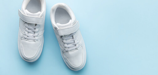 White sneakers on a blue background.