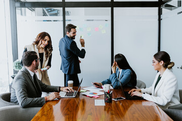 Group of latin business people or teamwork working using laptop at the office in Mexico Latin America, hispanic people
