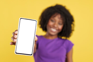 Hand of afro woman with mobile with a blank screen