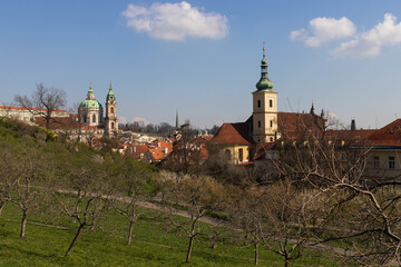 Fantastic view from the Petřín Gardens to the Prague Castle district with the Church of Our Lady Victorious to the right and the St. Nicholas Church on the left.