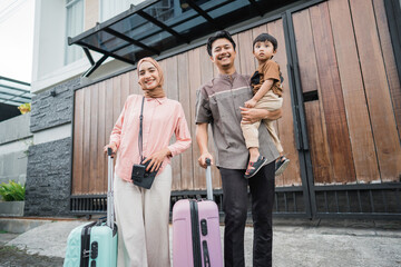 asian beautiful muslim family with suitcase travelling by car concept