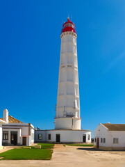 Fototapeta na wymiar lighthouse Santa Maria of Farol Island at the Algarve coast of Portugal