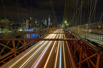 Fototapeta na wymiar Brooklyn Bridge at night with freedom tower in the background 