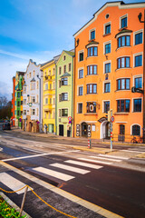 Obraz premium Innsbruck city skyline, buildings, and street landscape with vibrant colorful houses in historic landmark Tyrol in western Austria