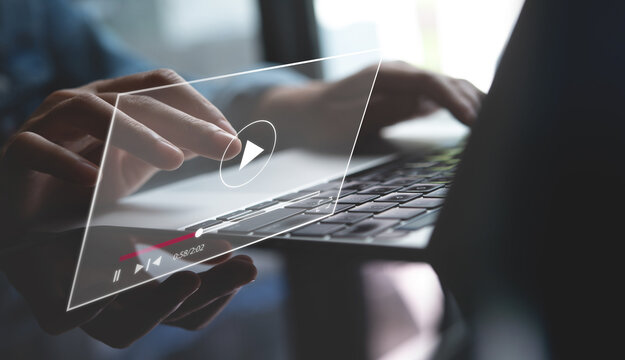 Video marketing concept. Woman playing video content online streaming, running short clip on laptop computer. Marketing technology and advertising for  online business, internet network