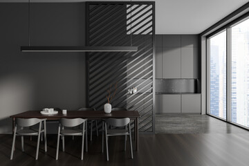 Dark gray kitchen and dining room interior