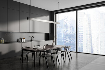 Grey home kitchen interior with dining and cooking corner, panoramic window