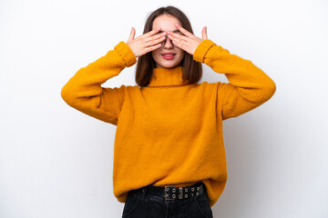 Young Ukrainian woman isolated on white background covering eyes by hands and smiling
