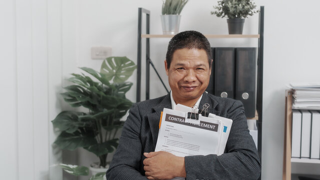 Happy, looking camera, Elderly Old Senior Asian male businessman wearing formal suit ,confident professional bookkeeper doing bookkeeping, lawyer, stock market trader or broker.