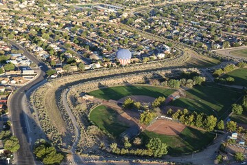 USA-themed hot air balloon over a little league baseball park in Albuquerque City, New Mexico