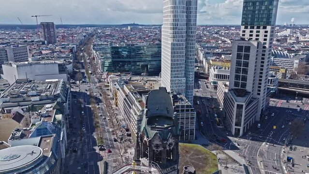 Drone shot of Kaiser Wilhelm Memorial Church ( Kaiser-Wilhelm-Ged&auml;chtnis-Kirche ) , Berlin on the Kurf&uuml;rstendamm in the centre of the Breitscheidplatz , Germany . 
