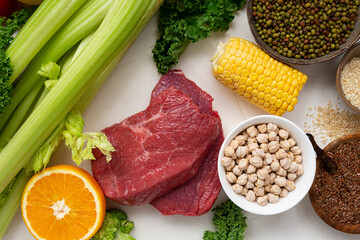 Overhead view of fresh cooking food background meat vegetables grains