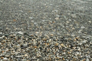 Shallow water with pebbles. Milford Sound, New Zealand.